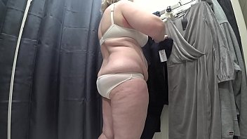 A Curvy Mature Woman With A Plump Ass In White Panties And Full Breasts In A Bra Was Caught On Hidden Camera In A Public Changing Room.