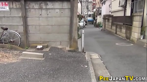 Asian Babe Squats And Pisses