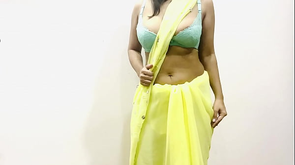 Voluptuous Indian Bhabhi Teases In A Tight Yellow Saree